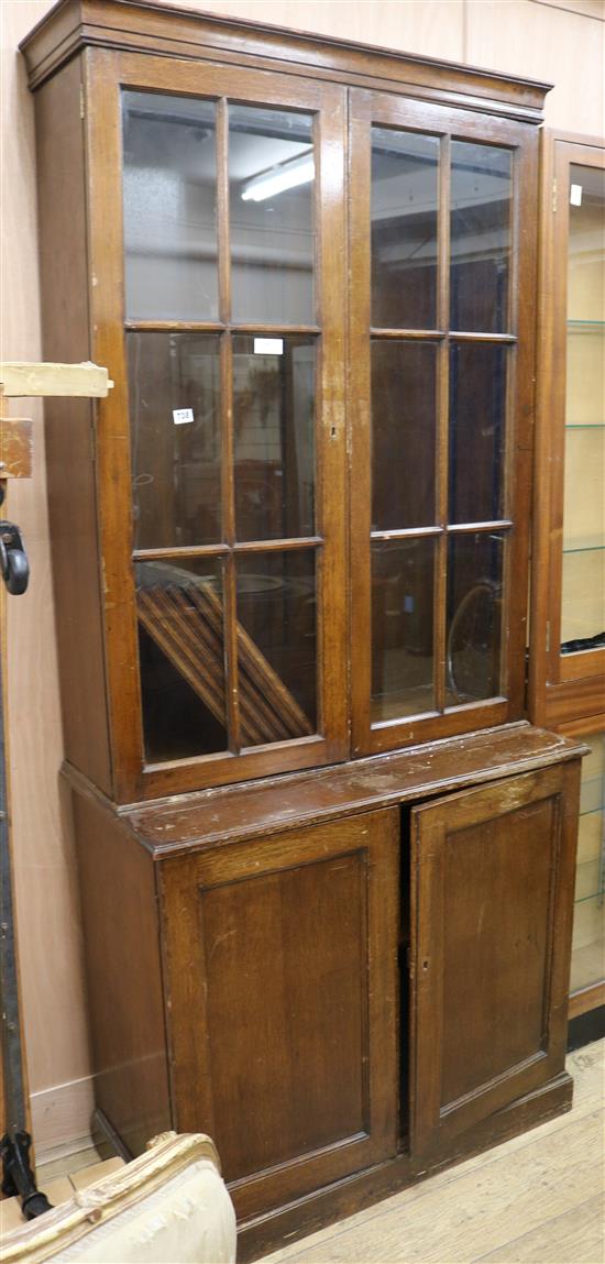 An Edwardian oak bookcase, W.94cm